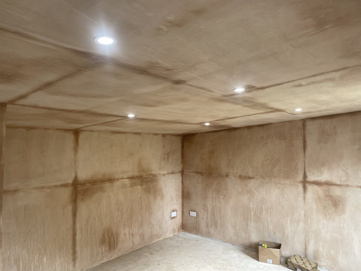 Recessed downlights in a freshly plastered ceiling
